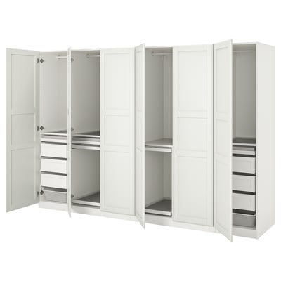 White PAX wardrobe: six doors open to reveal shelf, hanging, and drawer storage. Modern, clean design in white.