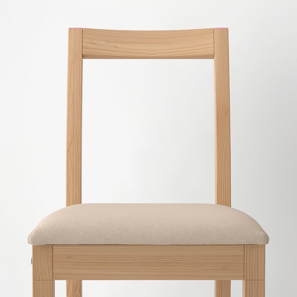 Light wooden chair with beige cushion, sturdy and modern, ideal for dining.