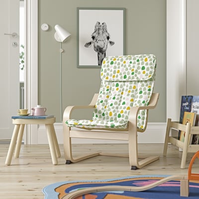 Colourful poang chair with dot cushion, teapot table, cosy room
