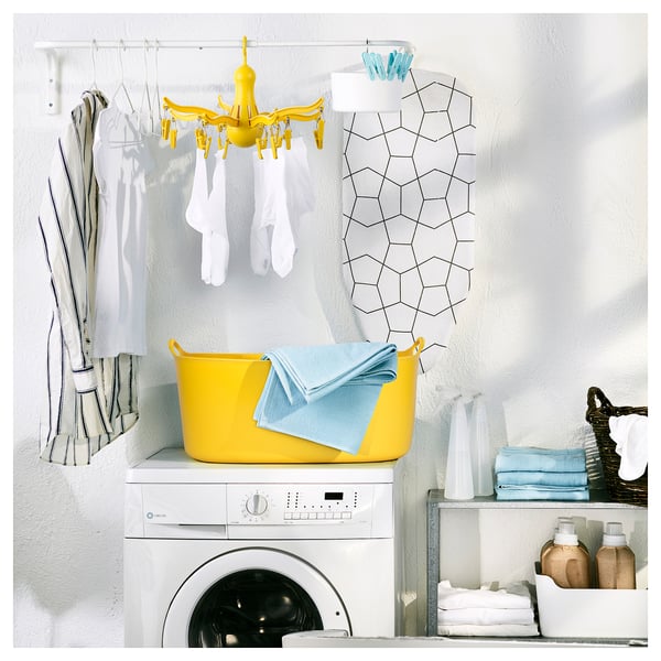 Bright yellow laundry accessory, PRESSA, hanging dryer with 16 pegs, drying socks and small items indoors.