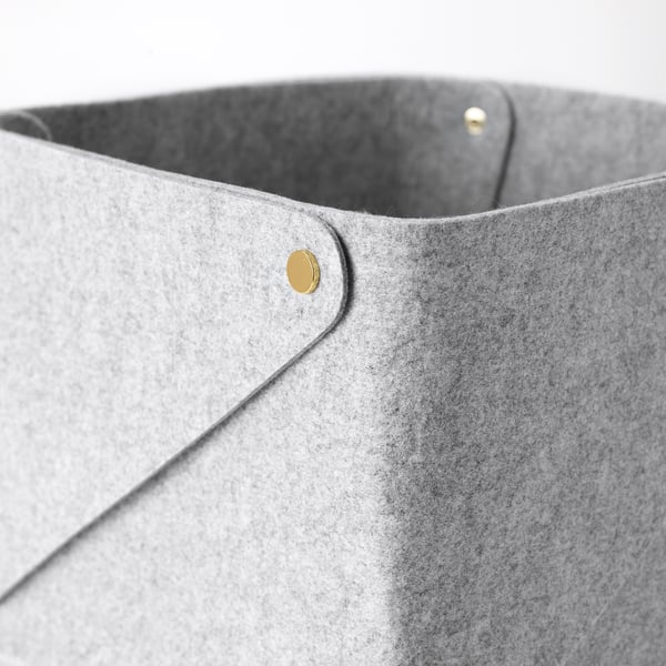 Grayscale basket with gold button.