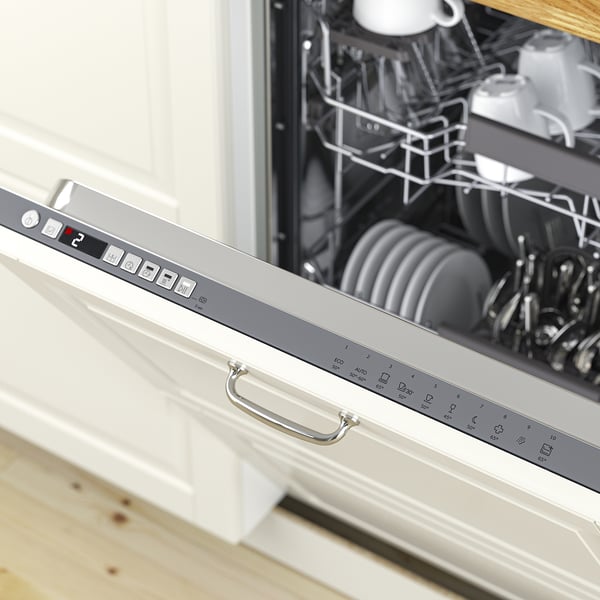 Open dishwasher displaying plates and cutlery, control panel visible with settings for different wash programmes and options.