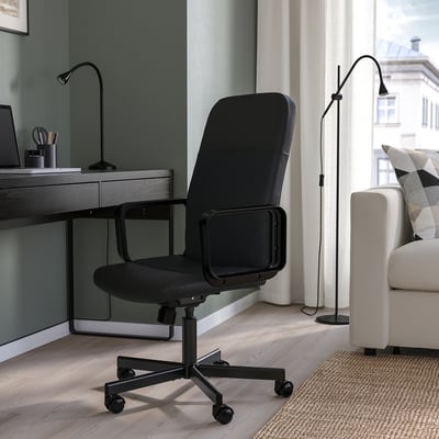Black RENBERGET office chair between desk and couch, medium size.