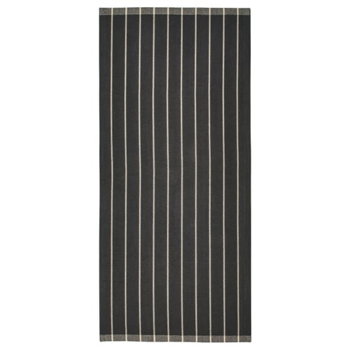 Grey rectangular foot-friendly cotton rug with white stripes.