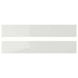 Two sleek, modern grey kitchen drawer fronts with high-gloss finish, straight lines, and durable plastic foil surfaces.