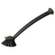 Black kitchen brush with long handle and suction cup for scrubbing surfaces.