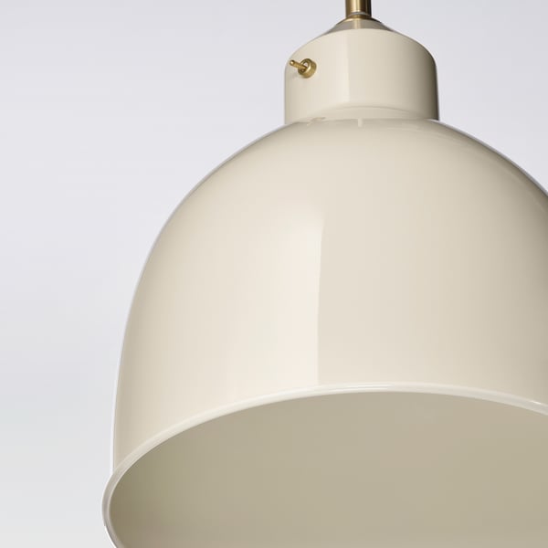 Close-up of modern pendant lamp with smooth finish and subtle gold accents.