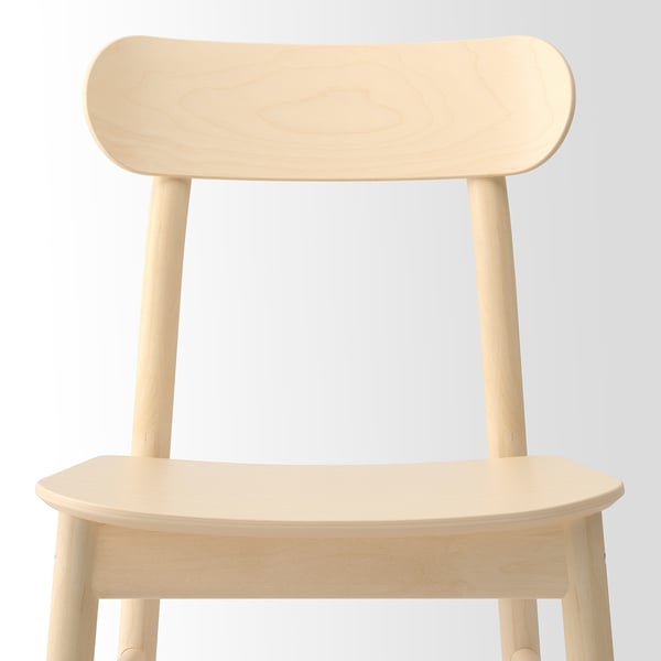 Minimalist light wood chair with smooth, rounded edges and backrest. Modern, clean design.