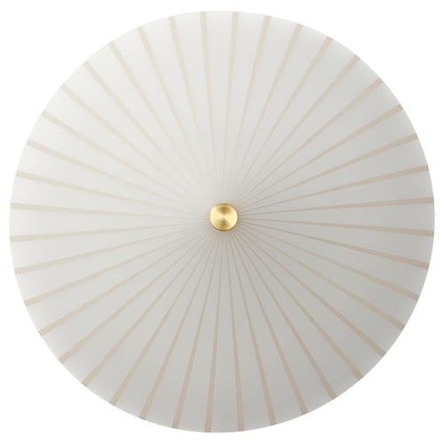 Round white lamp with gold centre, radial pattern.