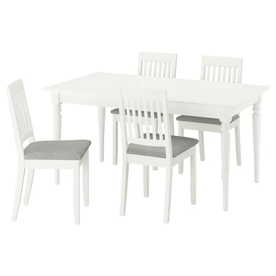 White ROSENTORP dining set. Square table with 4 matching chairs, cushioned seats. Classic, clean design.