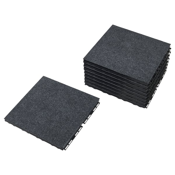 Stack of black RUNNEN floor tiles, interlocking, square-shaped, textured surface.