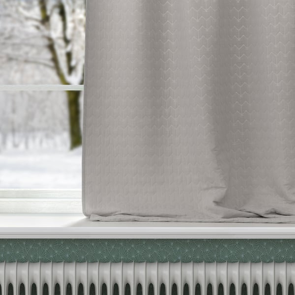 A curtain with textured pattern covers a window, its fabric blocks draughts and insulates heat, offering energy efficiency and privacy.