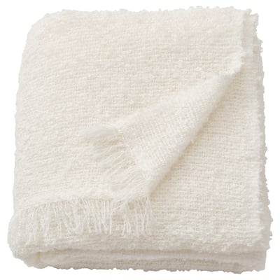 White SANDBRODD blanket, soft, textured, folded, fringed.