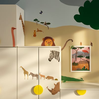 Safari-themed nursery with zebra, lion, and giraffe stickers.