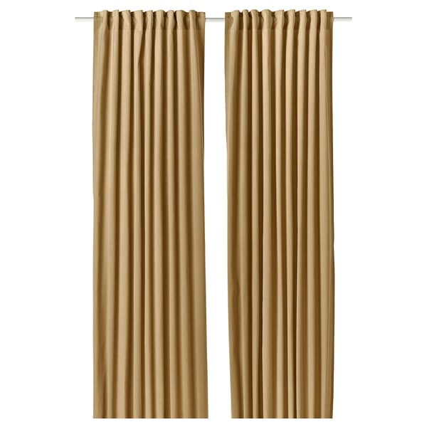 Pair of SANELA beige velvet curtains with rod pocket, elegantly draped, offering light philtre and sound dampening.