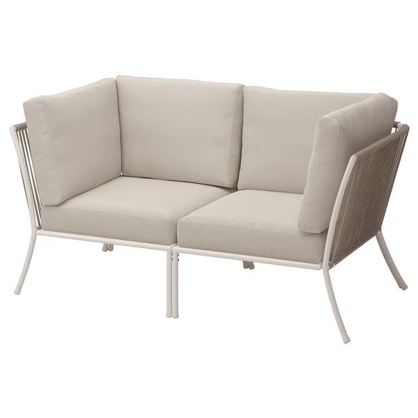 Modern beige outdoor corner sofa; steel frame, beige cushions.