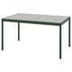 Green outdoor table with glass top, rectangular shape.