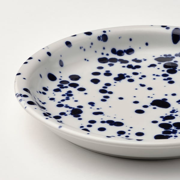 Dish, blue spots on white.