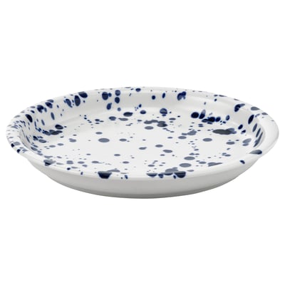 Round white plate with blue splatter design.