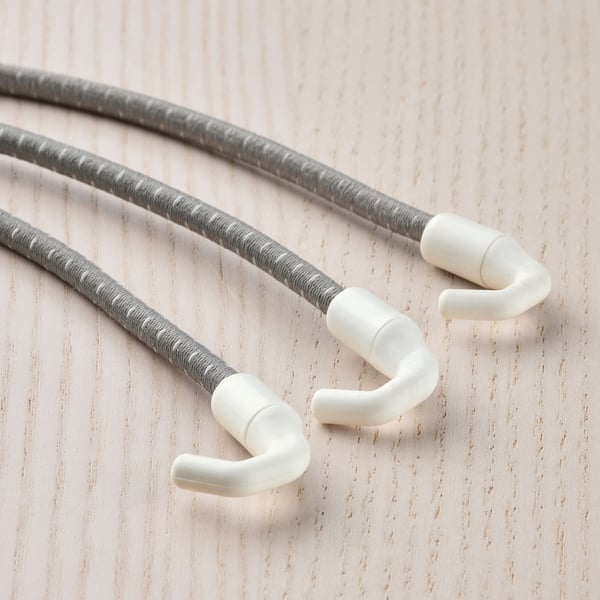 Three grey cords with white hooks on wood.