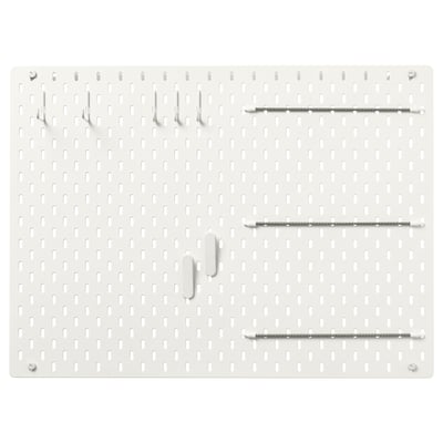 SKÅDIS white pegboard, rectangular with evenly spaced holes, holding various metal hooks and bars.