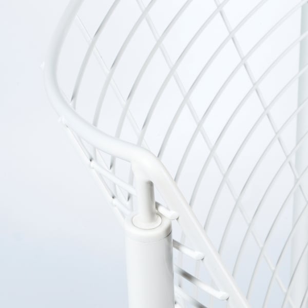 A close-up of a white metal chairs backrest, showcasing its intricate, curving lattice pattern and sturdy joints.