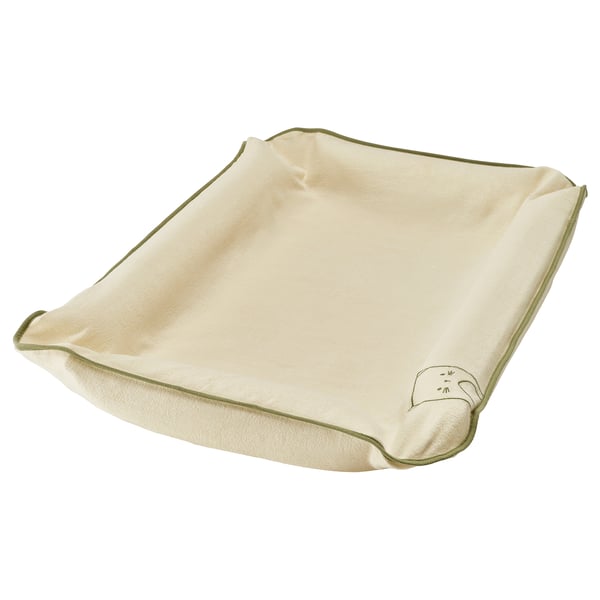 A SKÖTSAM organic cotton changing mat cover in beige with a green edge and a small cat design. It is square-shaped and made of soft terry material.
