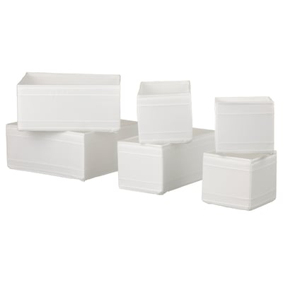 Stacked white SKUBB storage boxes, rectangular, fabric with zip and mesh tops.