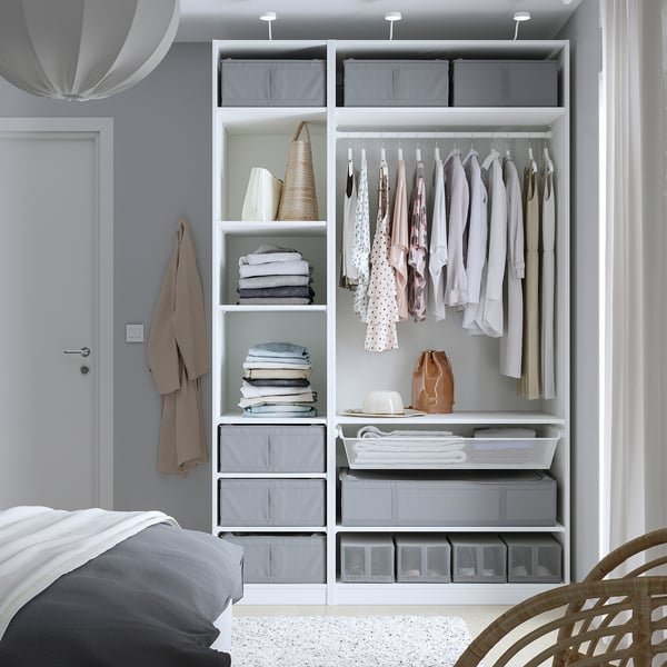 Bedroom closet filled with SKUBB storage cases in a pax wardrobe, holding clothes, and bedding, efficiently organising and protecting items from dust.