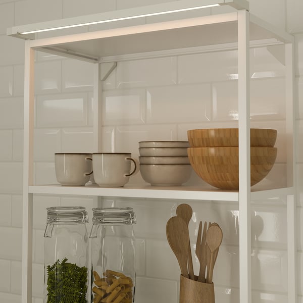 Kitchen shelf with led lights, mugs, bowls, jars, utensils. Or shelf with led lights, mugs, bowls, jars, and utensils.