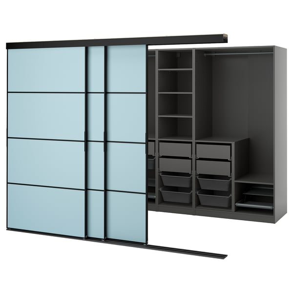 A blue SKYTTA sliding wardrobe with black interiors. It shelves, drawers, and a clothes rail.