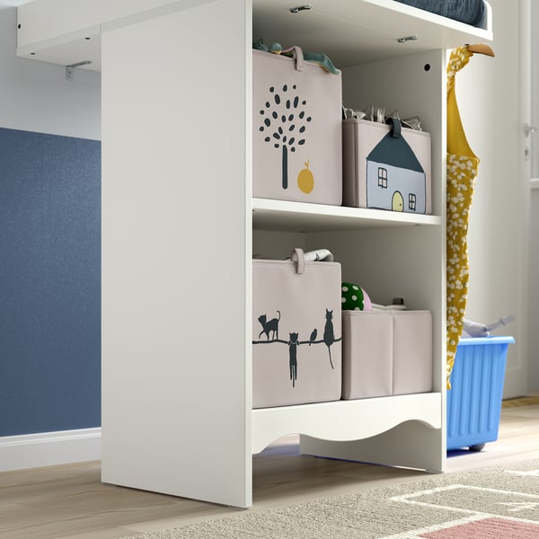 White SMÅGÖRA changing table with shelves holding decorated storage boxes.