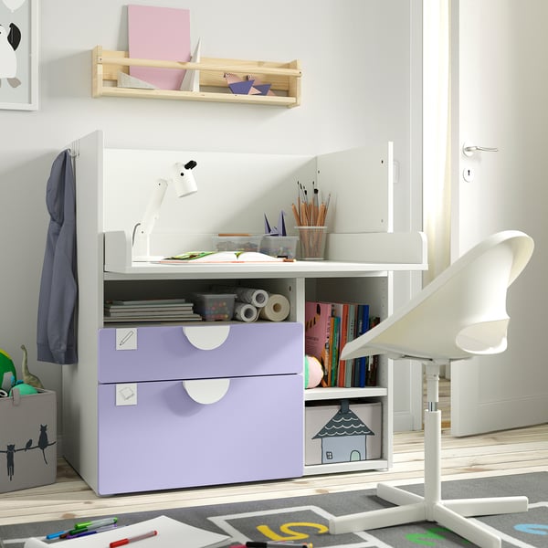 Child’s white study station with purple drawers, creative tools, and books. Compact, neat, and organised.