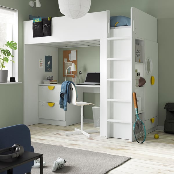 Small bedroom with SMÅSTAD loft bed, desk, and wardrobe in green and blue.