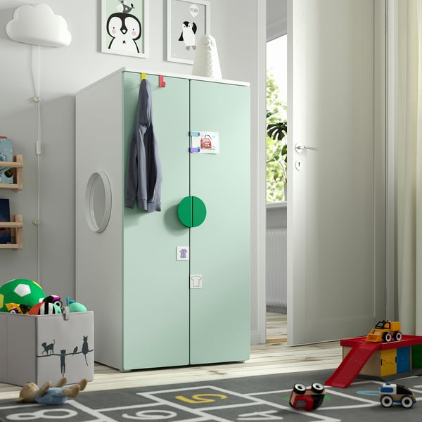 Kids room with light green SMÅSTAD cabinet, toys, and playful decor.
