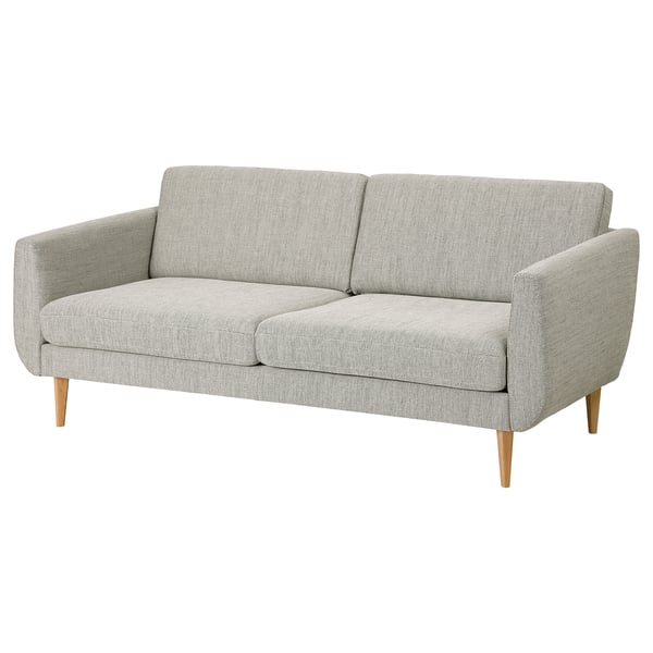 A grey SMEDSTORP sofa with retro style and modern comfort, displaying soft shapes, foam cushions, armrests, and cone-shaped legs.