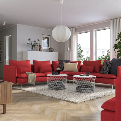 Modern living room with red SÖDERHAMN sectional sofa, light rug, and white coffee table.