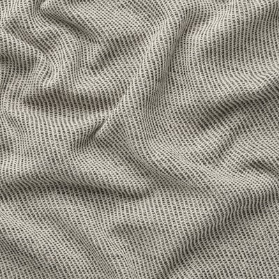 A close-up of a textured, grayish-white woven fabric with a soft, durable feel, likely from a sofa cover.