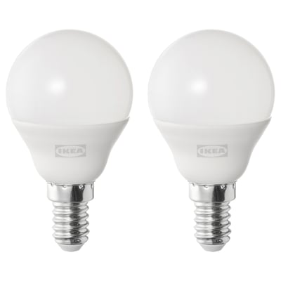 Two white ikea led bulbs, spherical shape, cool-white light, stand on metallic bases.