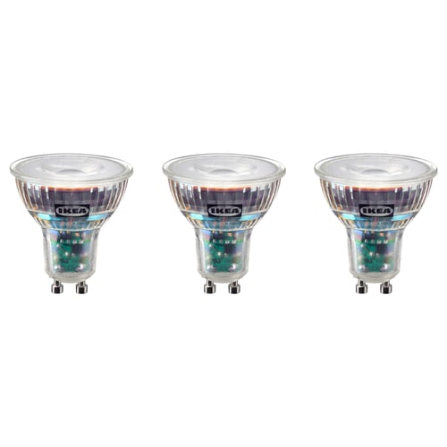 Three IKEA SOLHETTA led bulbs in warm-white light colour, rectangular shape, clear glass housing with plastic base, arranged in a row.