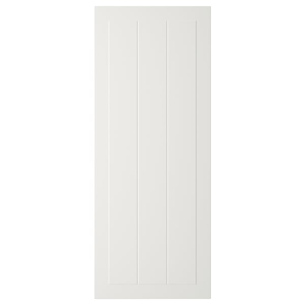 A white, rectangular STENSUND door with vertical grooves, made of fiberboard, lacquered for easy cleaning.