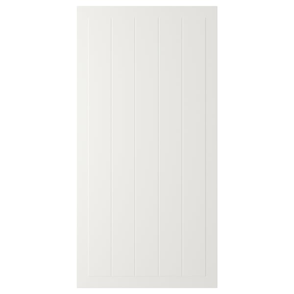 A white STENSUND cabinet door with grooved panels.