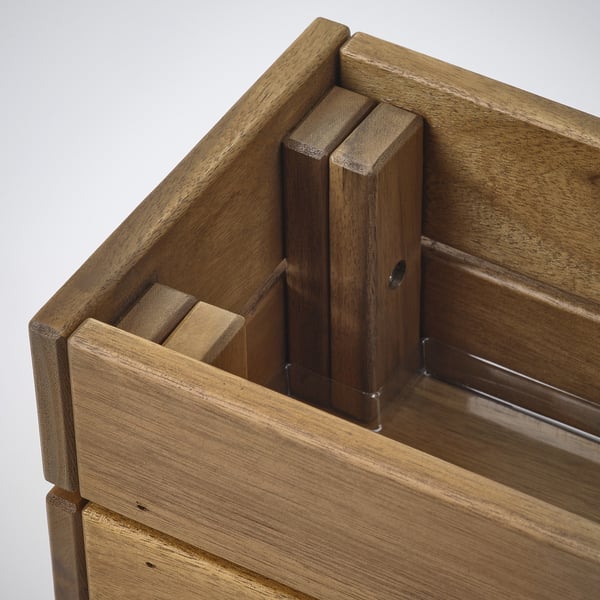 Wooden planter box made of acacia with visible joinery and metallic hardware for secure stacking, against white background.