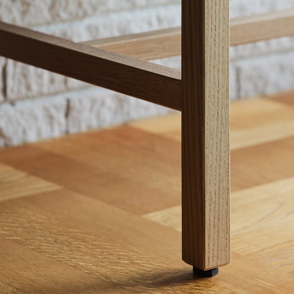 Close-up of sturdy wood table leg, showcasing fine grain texture and natural finish.