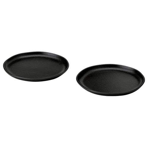 Two black, round, rustic-style side plates with irregular, textured surfaces and matte finish.