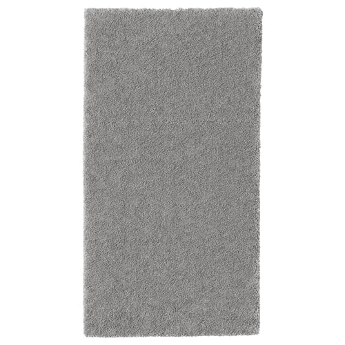 Grey rectangular STOENSE rug with soft, thick pile for comfort and sound dampening.