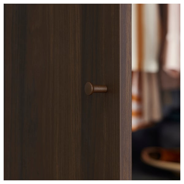 Dark brown wooden door with round handle, showcasing clean, minimalist design.