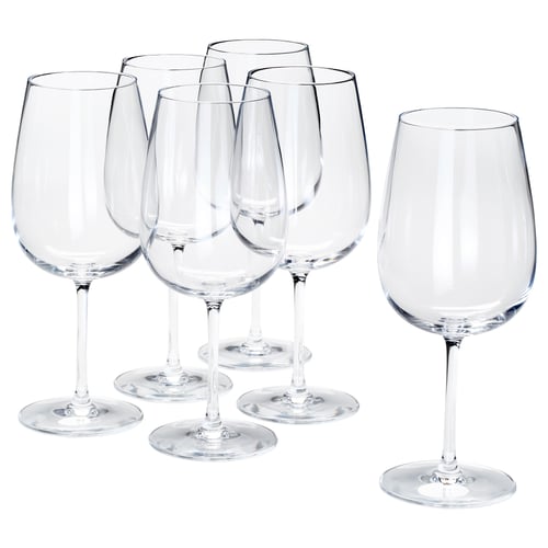 Six STORSINT crystal wine glasses, clear, long-stemmed, tall, grouping together on white background.
