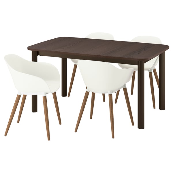 Dark wooden extendable dining table with four white chairs. Simple design, sturdy steel legs, comfortable scoop chairs with wooden legs.