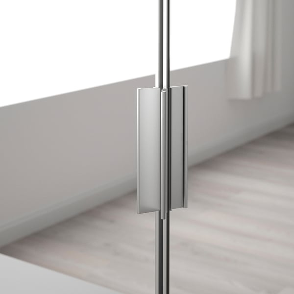 Close-up of sleek, modern mirror door handle on reflective surface, showcasing quality and design.